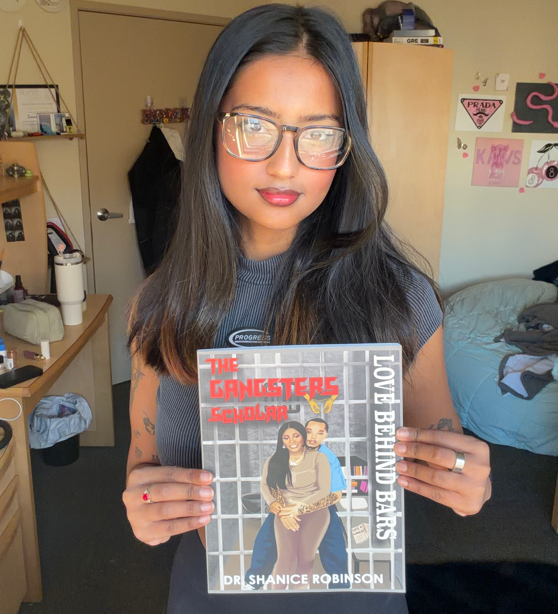 Tamanna holding the published Gangsters Scholar book